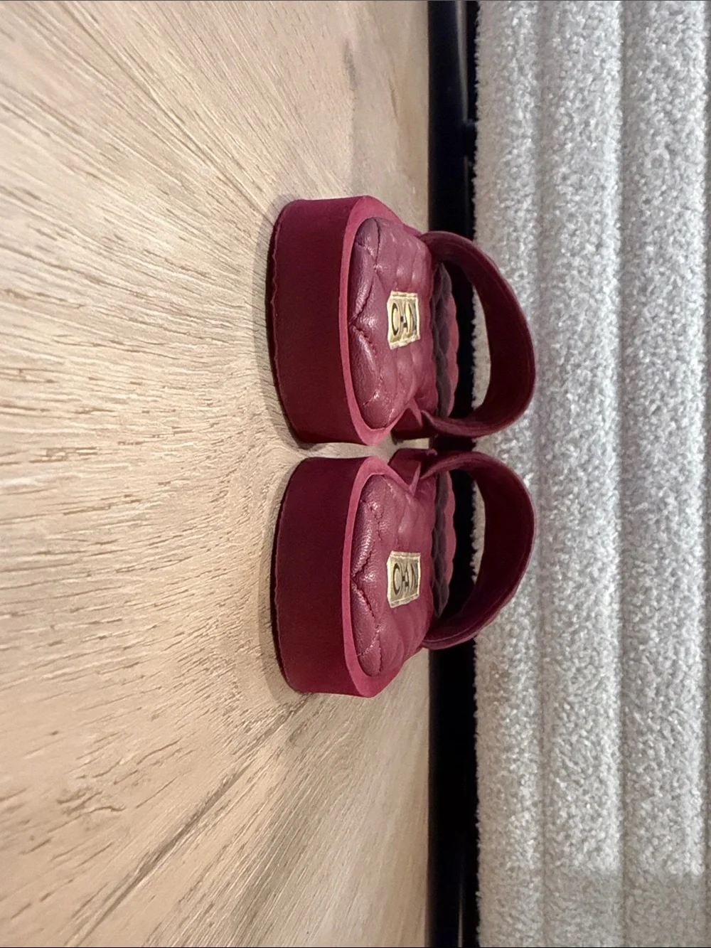 CHANEL Quilted Burgundy Slide Mules with Gold CC Emblem